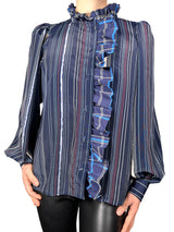 Blusa cuello alto con vuelos
