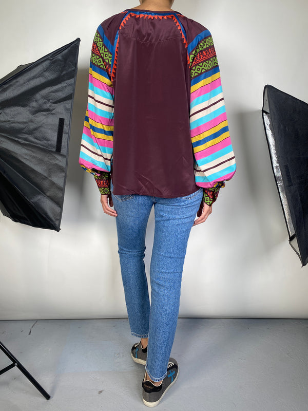 Blusa Okon Sekou